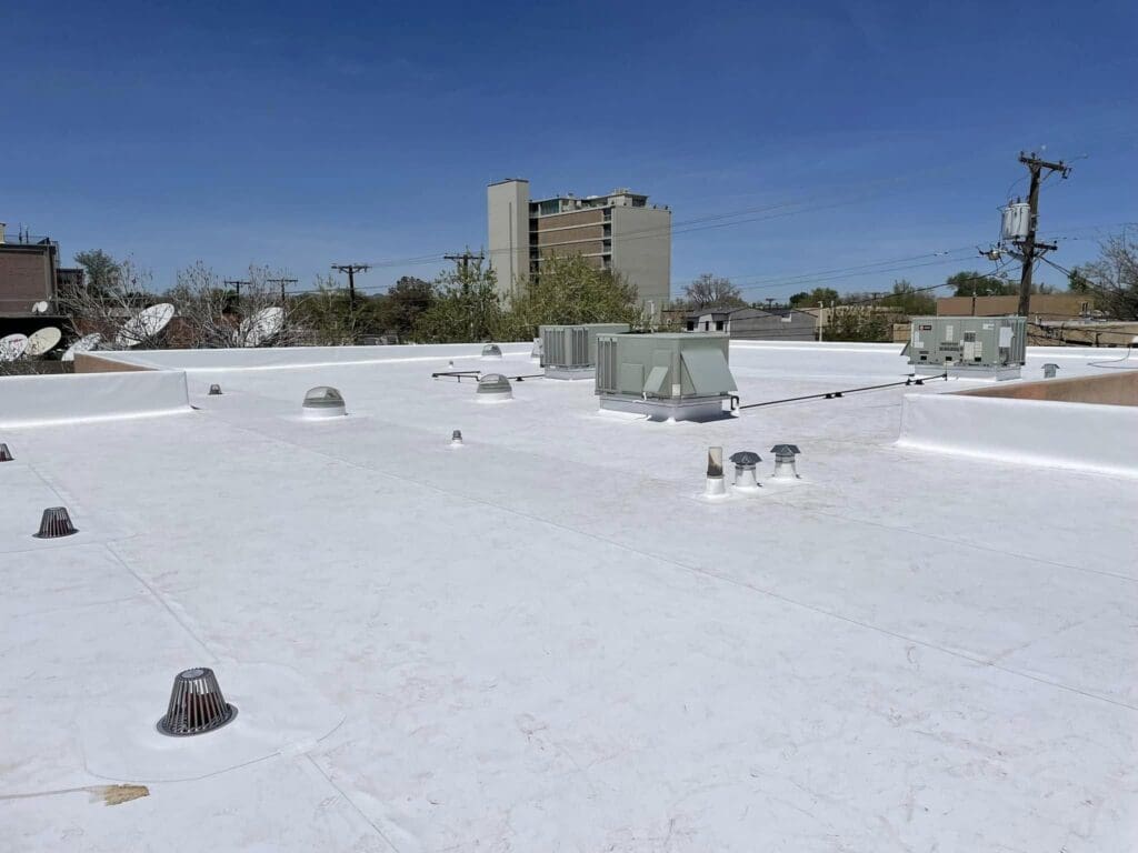 White TPO membrane roofing installed on a commercial building in New Mexico.
